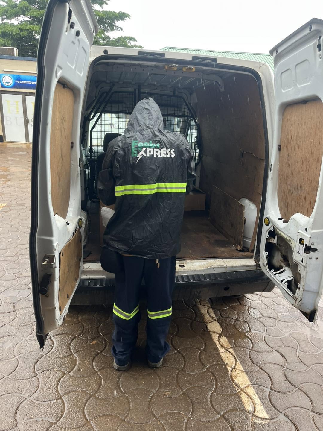Feebs Express delivery team moving a refrigerator